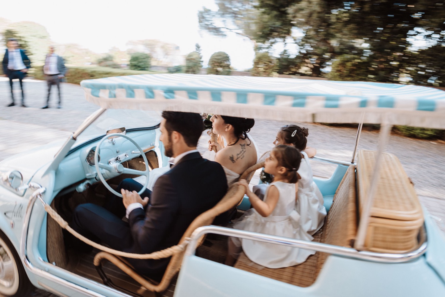 The couple in a light-blue Fiat Jolly