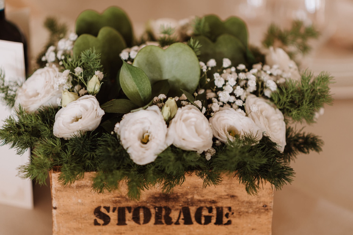 White flowers in a wooden crate