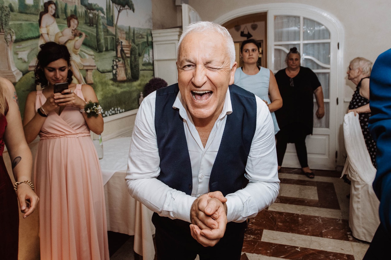 A guest laughing during the party