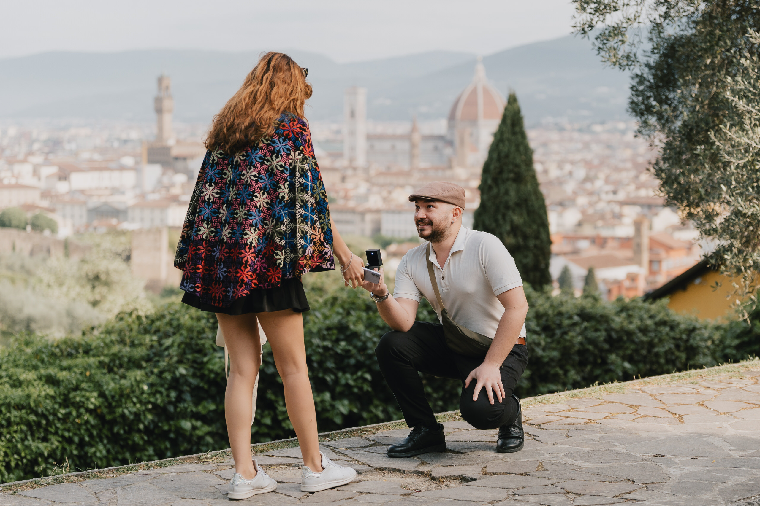 Surprise proposal on a terrace overlooking Florence, Palazzo Vecchio and the Duomo in view