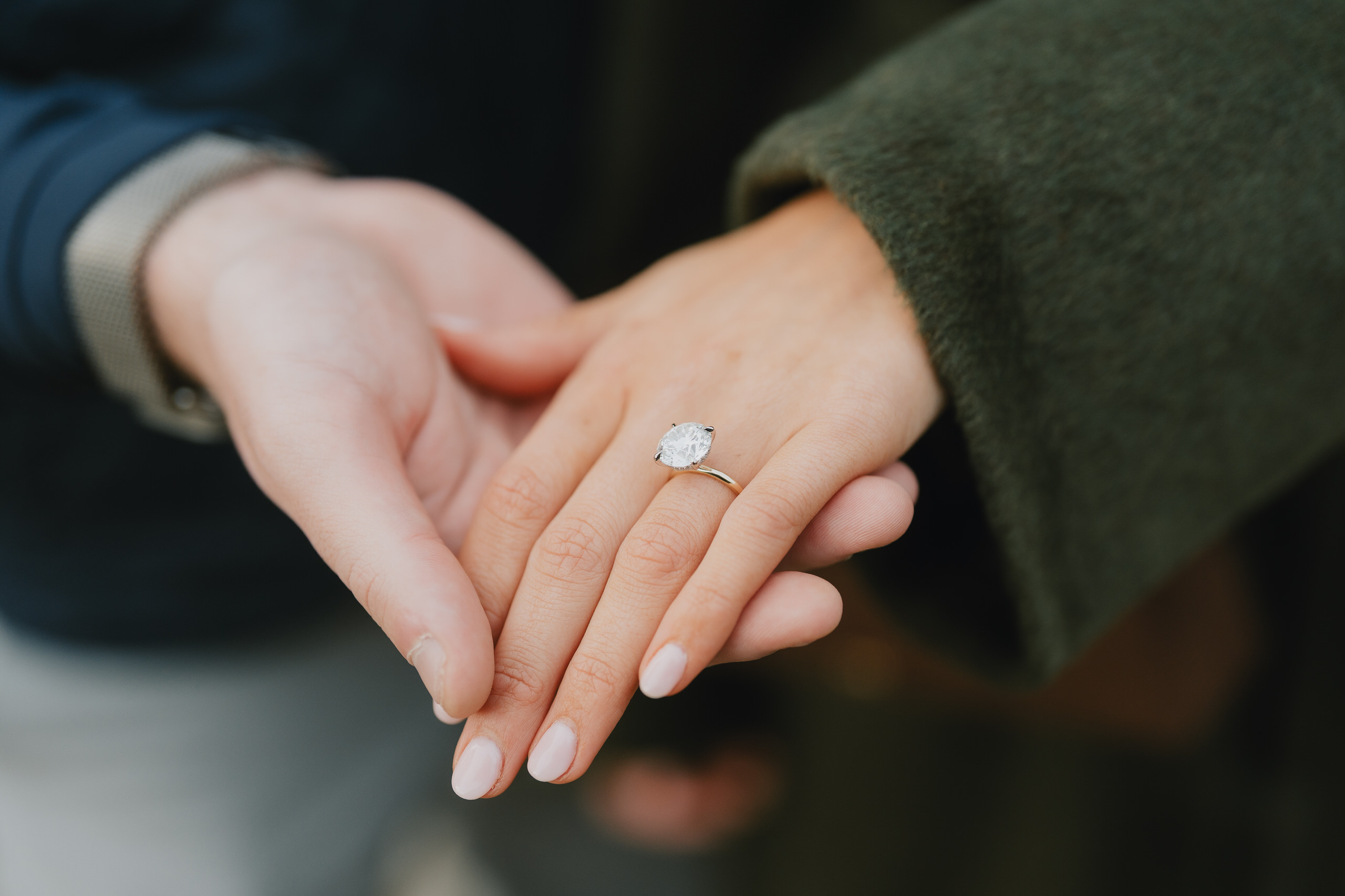 Engagement ring on her hand, close-up after a proposal in Florence