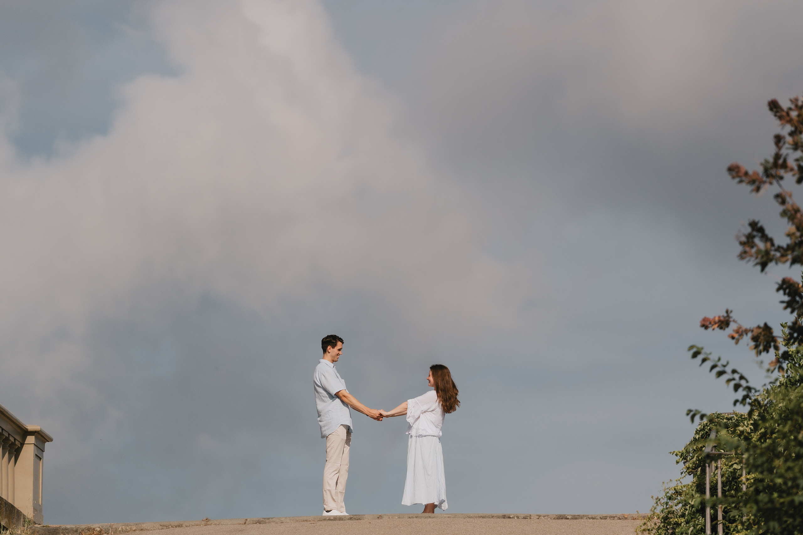 Proposal on a hilltop above Florence under a stormy sky