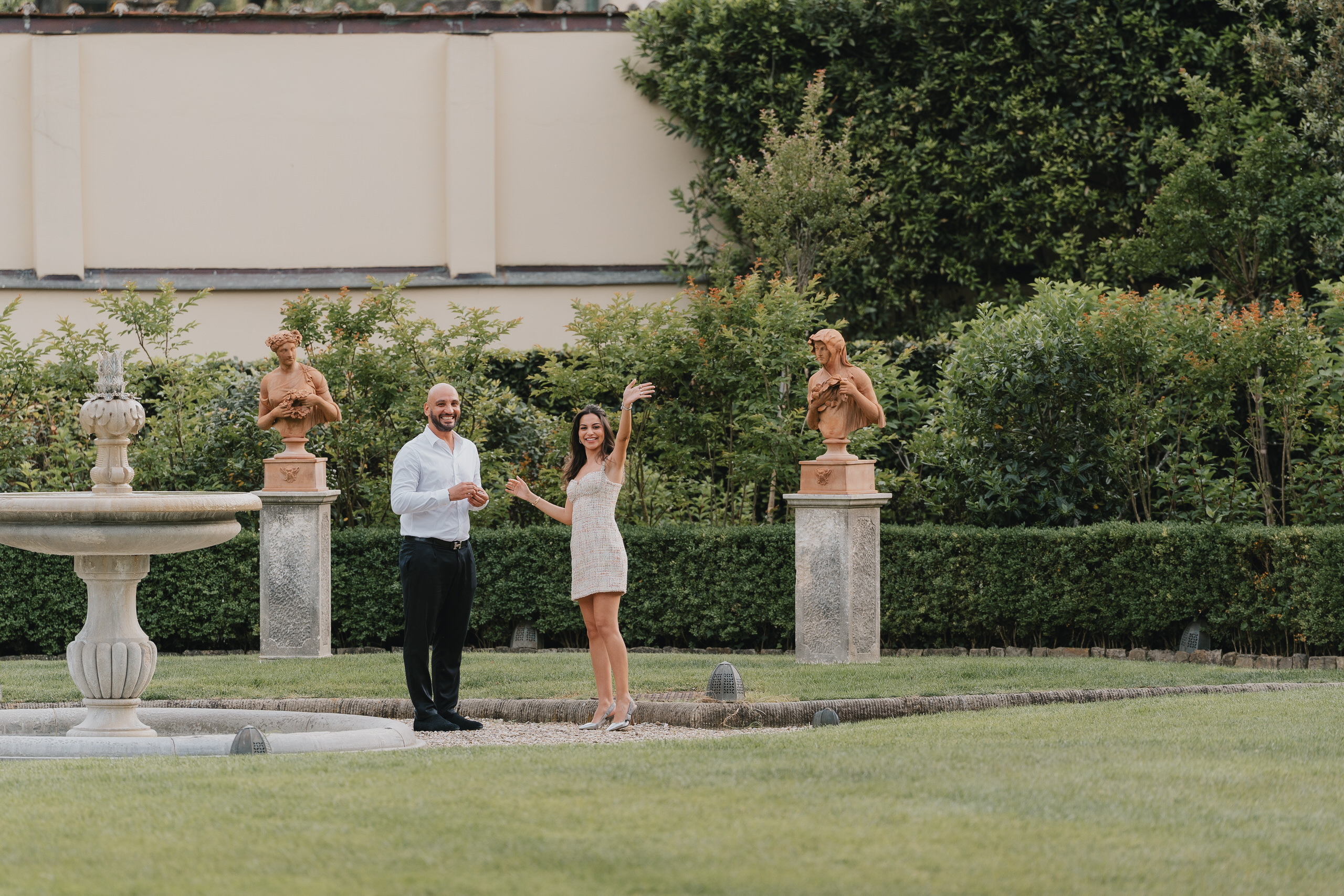 Proposal in the gardens of the Four Seasons Hotel Florence, the Duomo dome beyond the wall