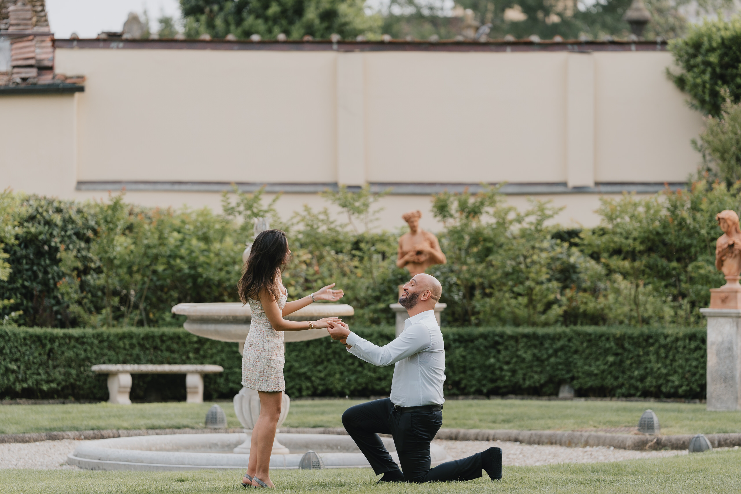 She reaches for him as he kneels by the fountain, Four Seasons Hotel Florence