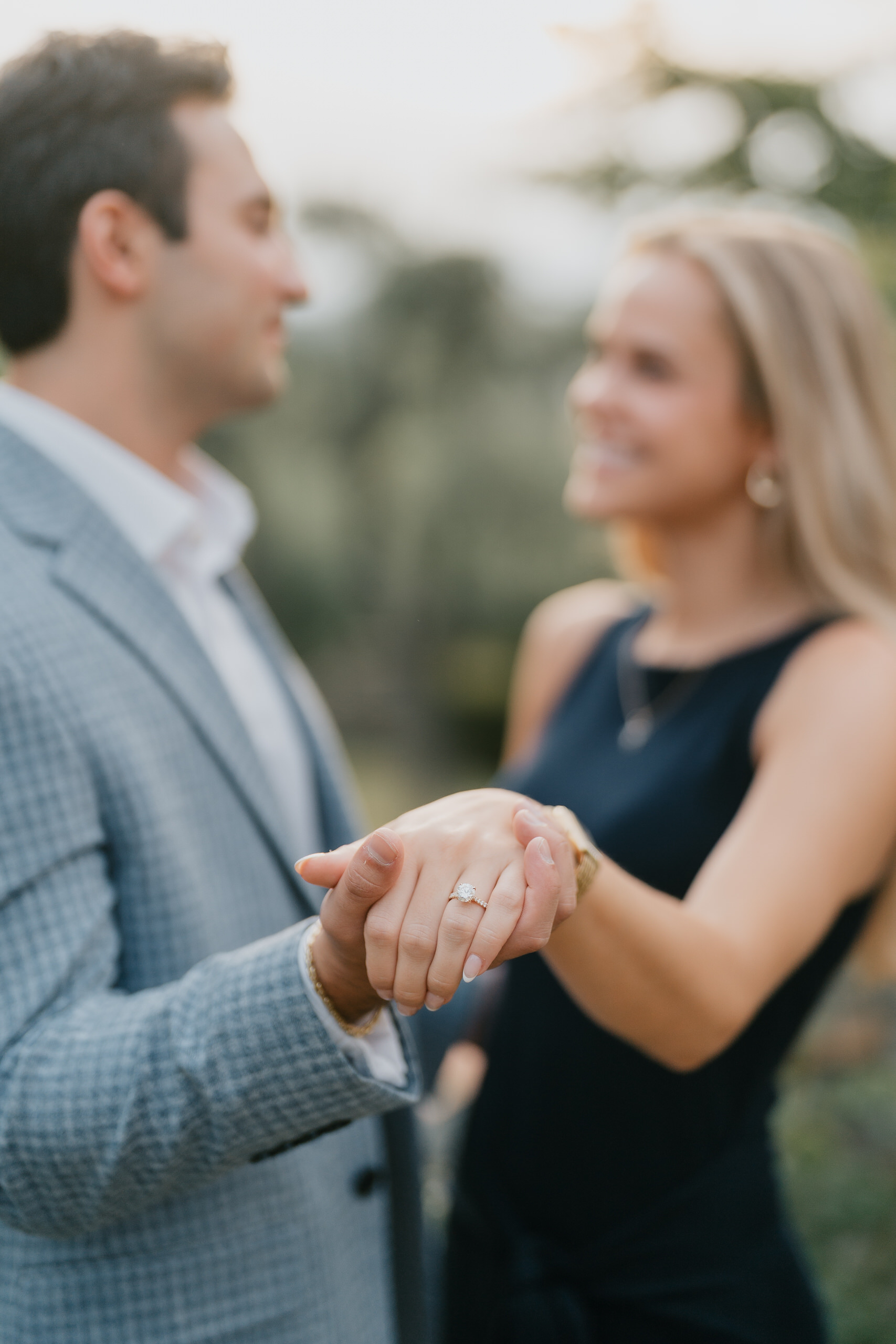 She holds his hand to show the ring, Villa Agape garden, Florence