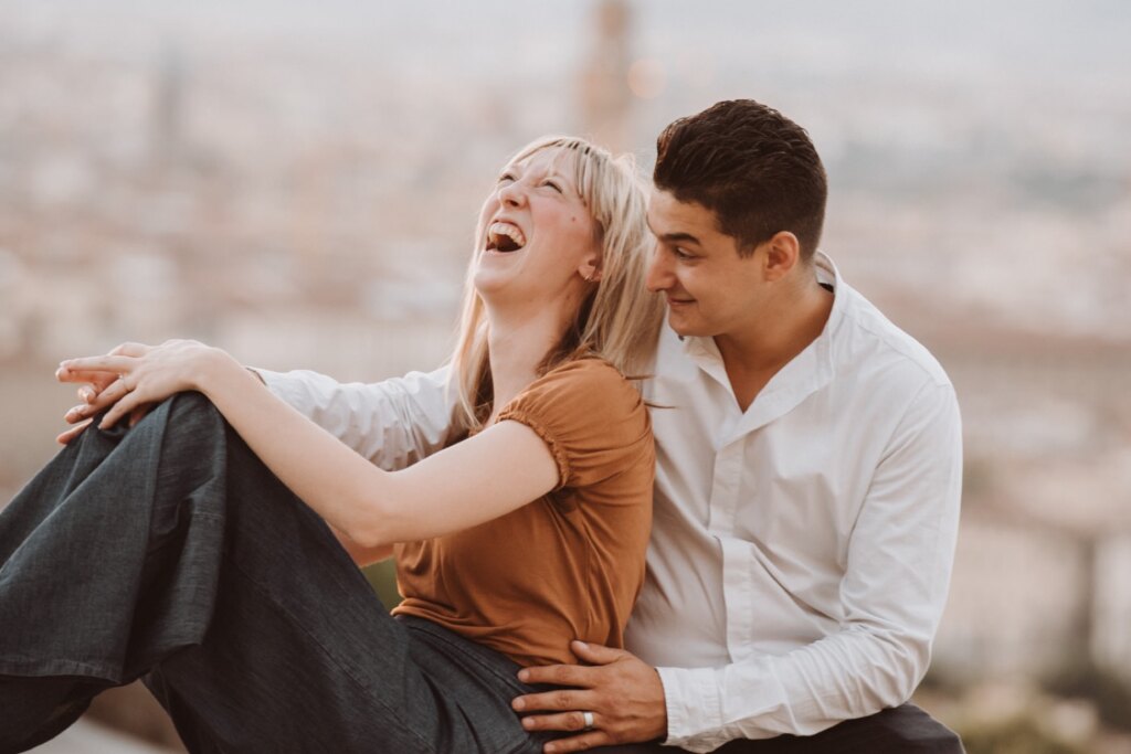 Engagement in Florence: laughter at Piazzale Michelangelo with the Duomo